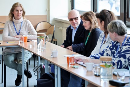 Conference participants sitting at the table. Click to zoom the picture.