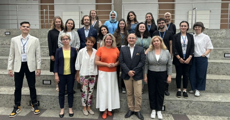 A group of students from the summer program with their supervisors.